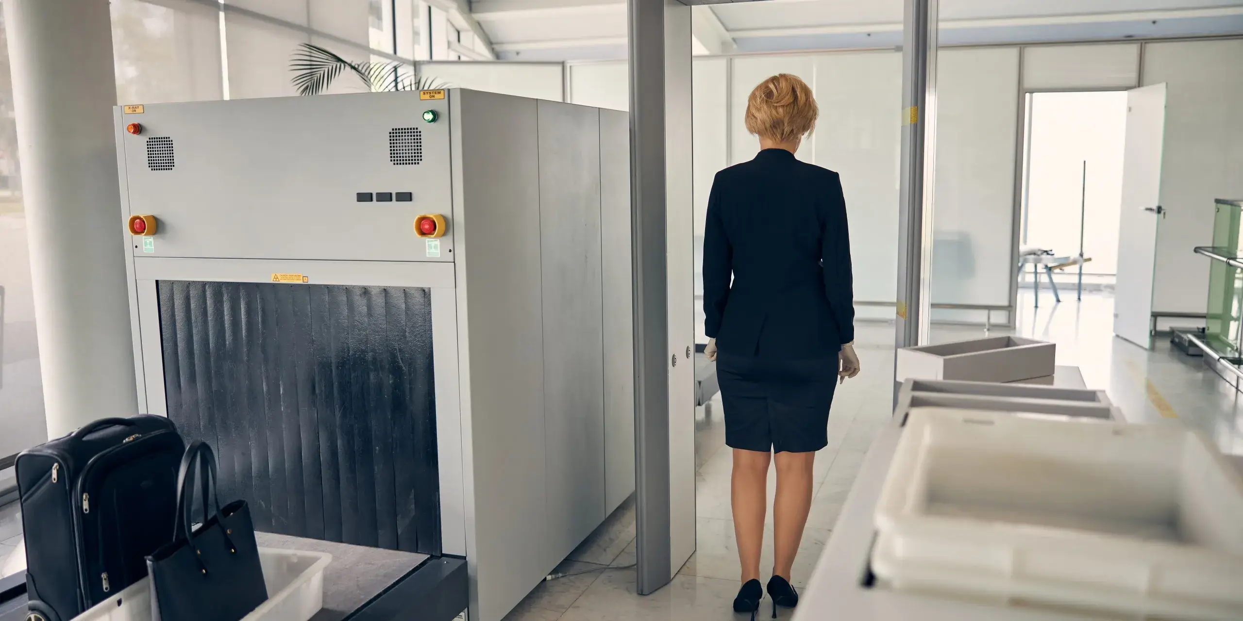 elegant-woman-walking-through-security-control-gat-2023-11-27-04-49-29-utc