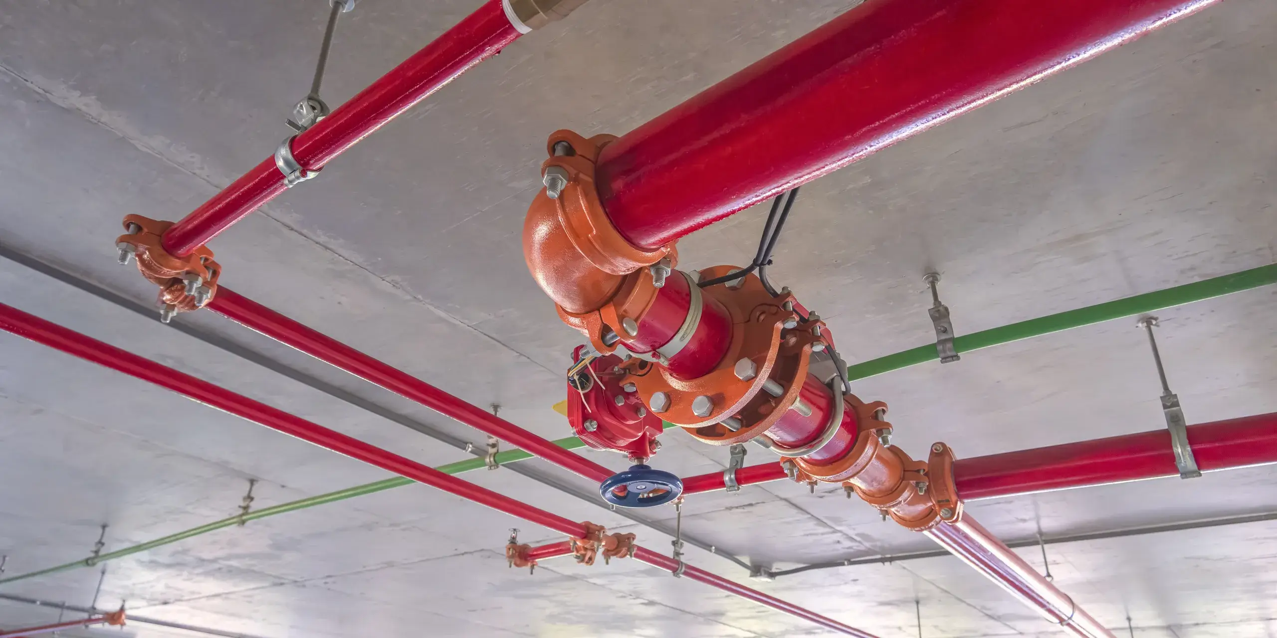 red-fire-protective-water-pipeline-system-on-concr-2023-11-27-05-28-01-utc