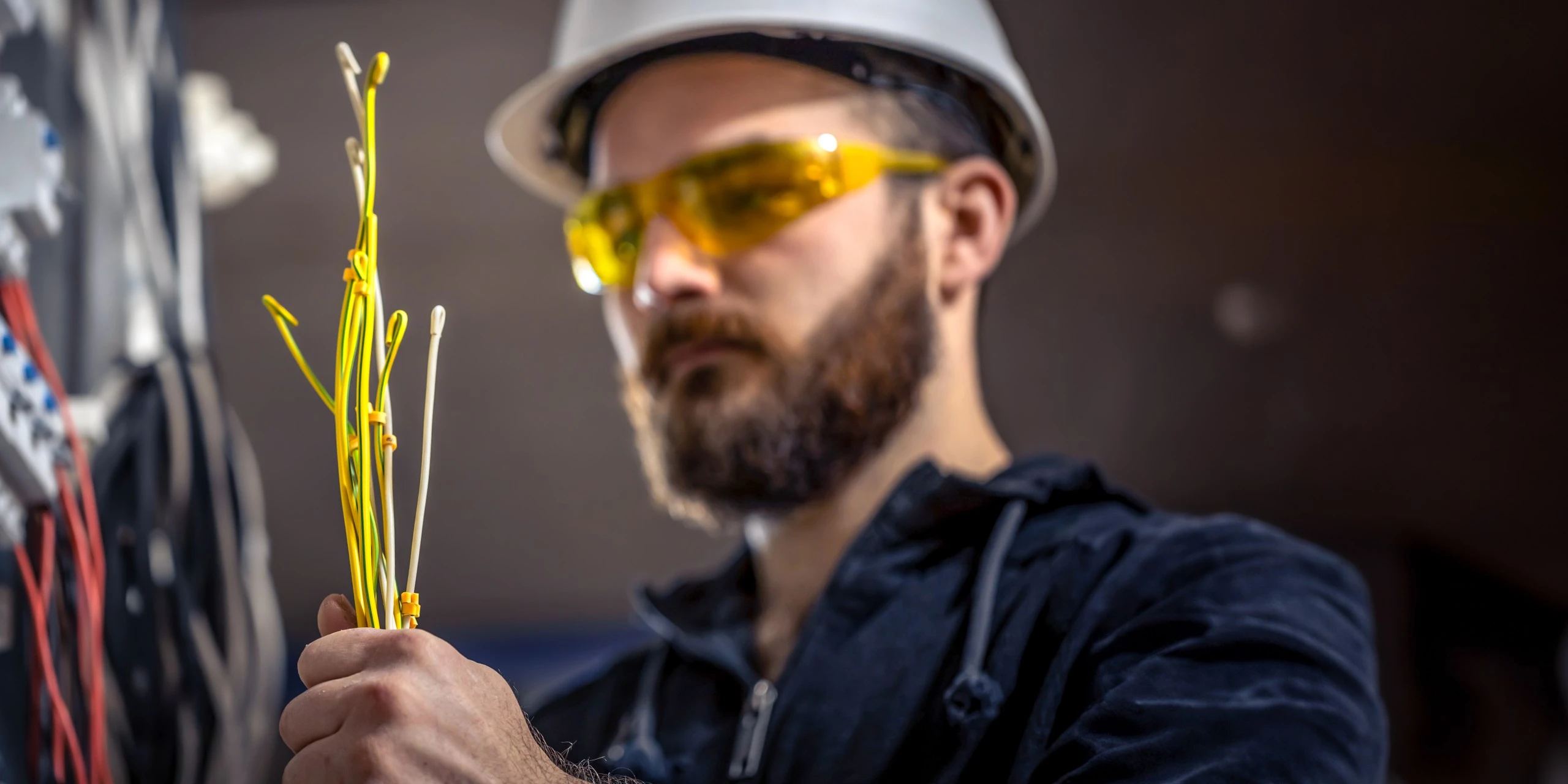 male-electrician-electrical-technician-working-switchboard