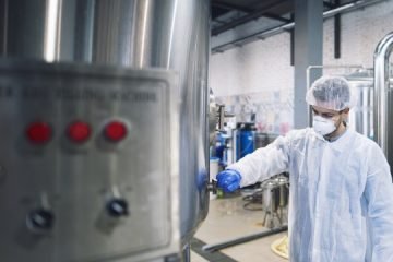 technologist-controlling-machine-production-plant